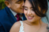 An image of a groom kissing his bride