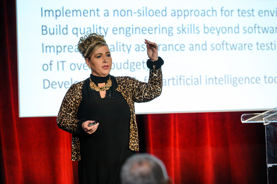 A female speaker presenting on stage at a Corporate Event held at Forager Tasting Room in San Jose